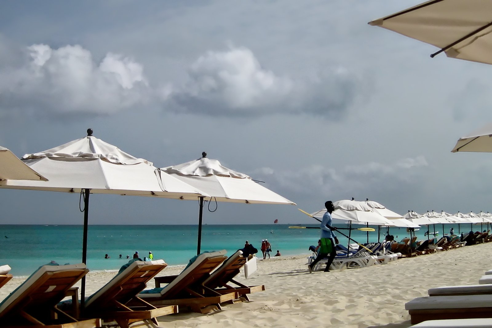 White beach umbrellas and loungers on Grace Bay beach, Turks and Caicos